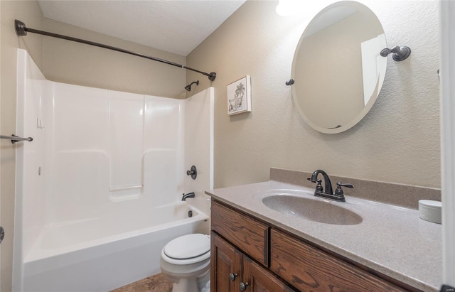 full bath with vanity, a textured wall, bathing tub / shower combination, and toilet