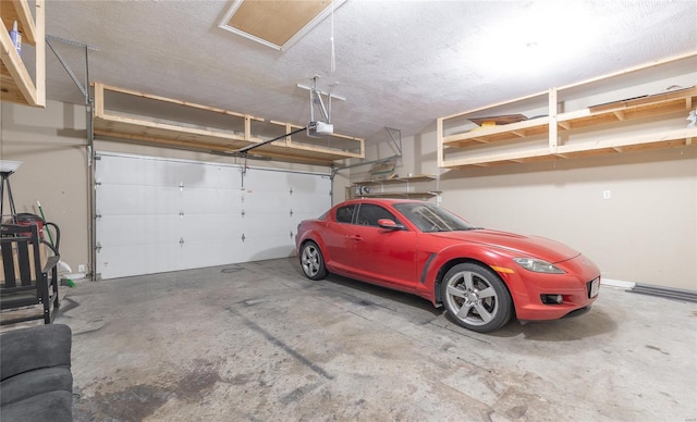 garage with baseboards and a garage door opener