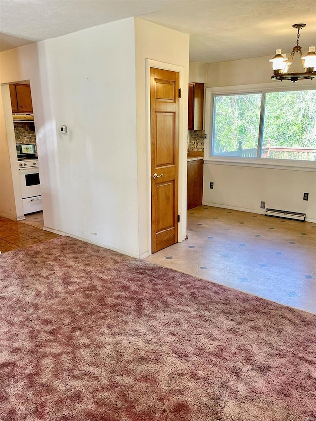 empty room featuring a baseboard heating unit, baseboards, a notable chandelier, and light colored carpet