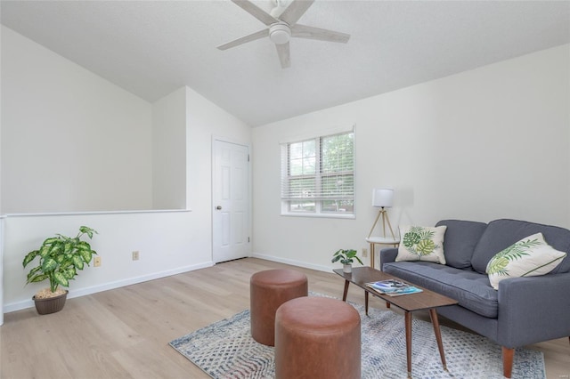 living area featuring a ceiling fan, baseboards, wood finished floors, and lofted ceiling
