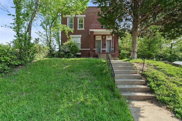 view of front of home featuring brick siding