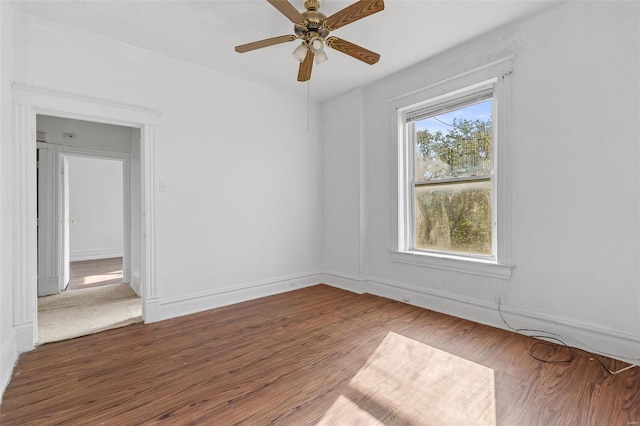 spare room featuring a ceiling fan and wood finished floors