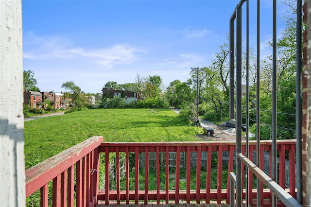 wooden deck with a yard