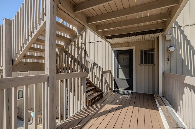 wooden deck featuring stairs