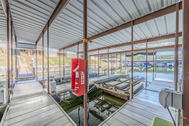view of dock featuring boat lift and a water view