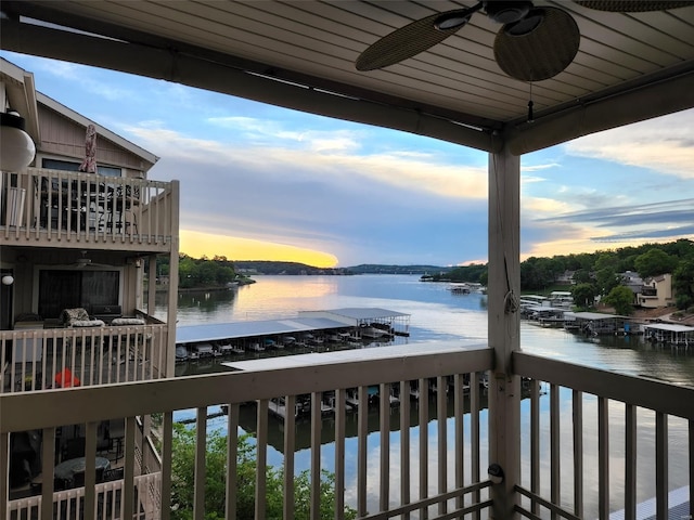 exterior space featuring a water view and a ceiling fan