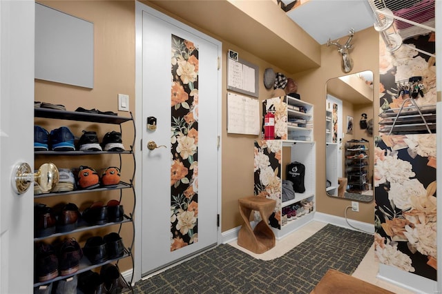 interior space featuring baseboards