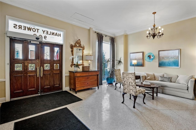 entrance foyer featuring a notable chandelier and ornamental molding