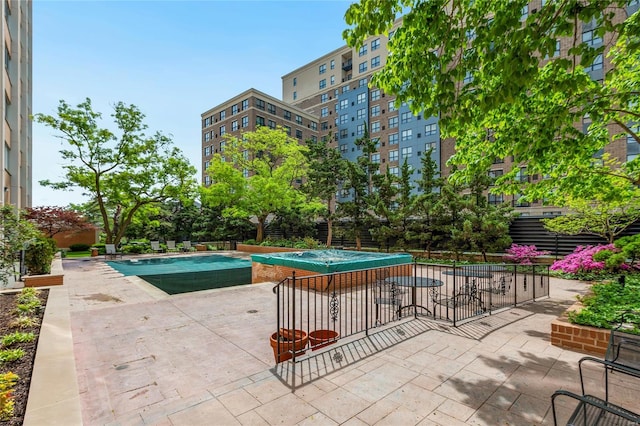 view of pool with a fenced in pool and a patio area