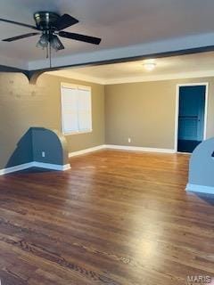 empty room featuring wood finished floors, baseboards, and ceiling fan