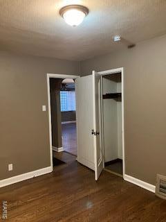 interior space featuring wood finished floors and baseboards