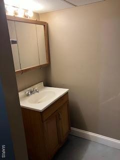 bathroom featuring baseboards and vanity