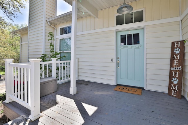 doorway to property featuring a deck and a chimney