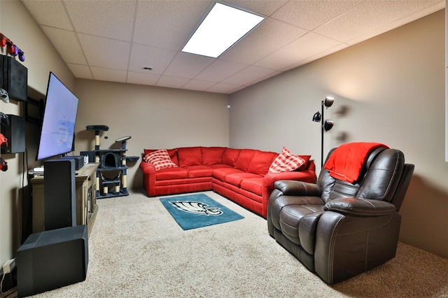 carpeted living room featuring a paneled ceiling