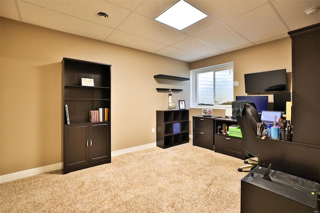 carpeted home office with baseboards, visible vents, and a drop ceiling