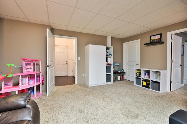 game room featuring a drop ceiling and carpet floors
