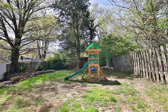 view of playground featuring a fenced backyard