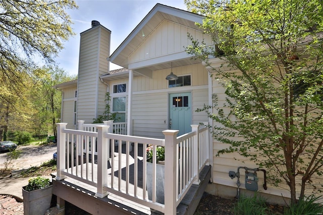 exterior space with a chimney and a deck