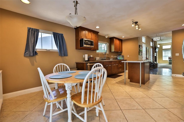 dining area with light tile patterned floors, recessed lighting, and baseboards