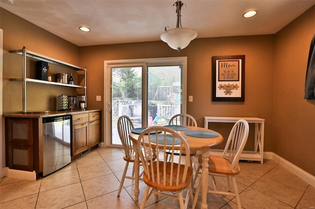 dining room with recessed lighting, light tile patterned flooring, indoor bar, and baseboards
