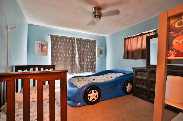 carpeted bedroom with ceiling fan