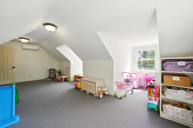 recreation room featuring a wall mounted AC, vaulted ceiling, carpet floors, and baseboards