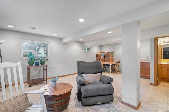 sitting room with baseboards, recessed lighting, and visible vents