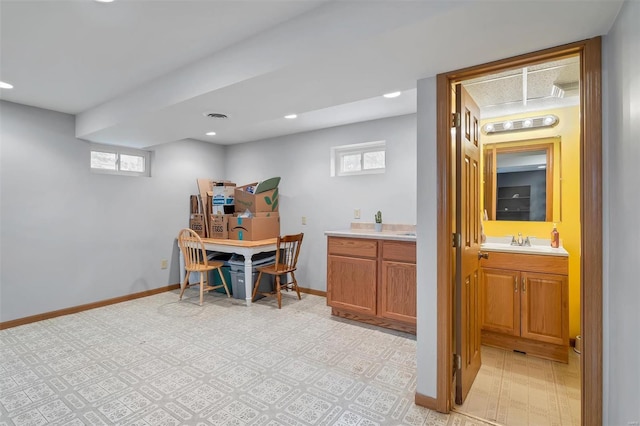 office area featuring a sink, recessed lighting, baseboards, light floors, and visible vents