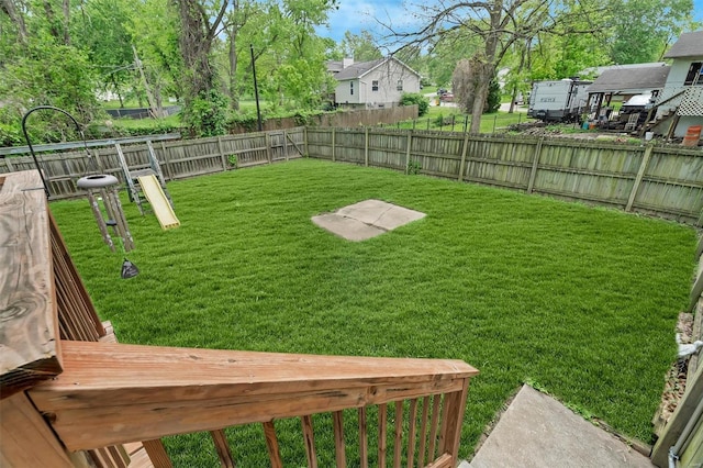 view of yard featuring a fenced backyard and a residential view