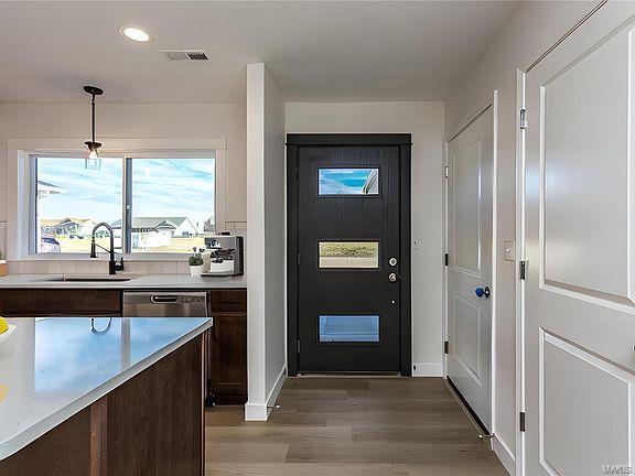 entryway with visible vents, light wood-type flooring, recessed lighting, and a sink