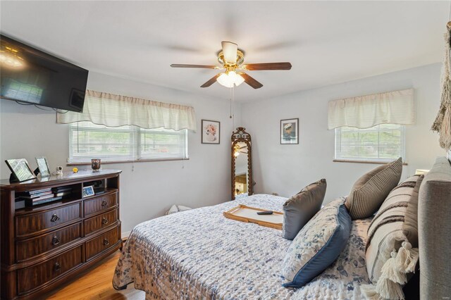 bedroom featuring a ceiling fan and light wood-style flooring