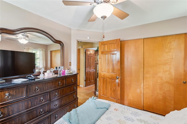 bedroom with ceiling fan and light wood-style flooring