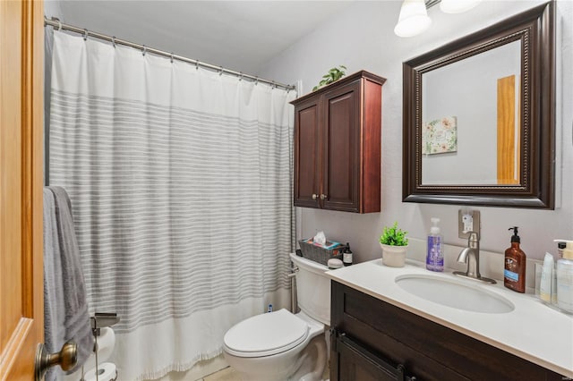 bathroom featuring toilet, shower / bath combination with curtain, and vanity