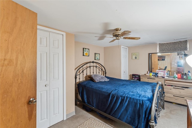 carpeted bedroom featuring visible vents and a ceiling fan
