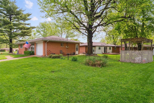exterior space featuring driveway, a pergola, and an attached garage