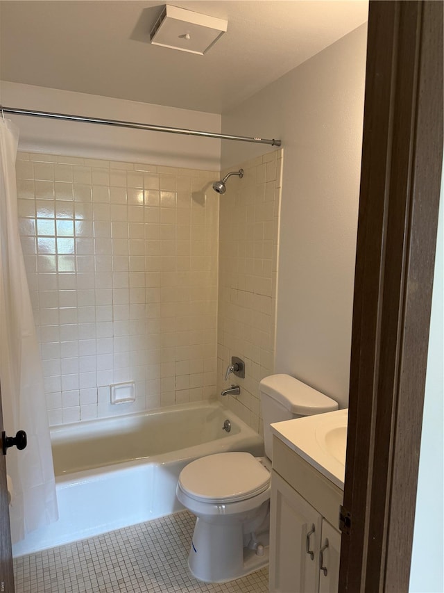 full bathroom with vanity, tile patterned floors, toilet, and shower / tub combo