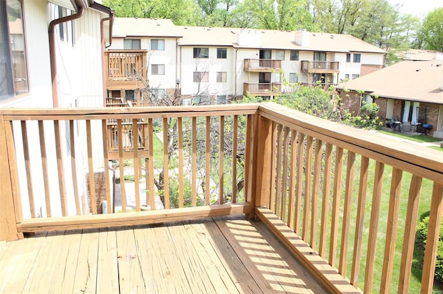 wooden deck featuring a residential view