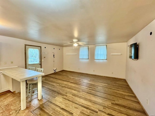 interior space featuring a ceiling fan and light wood-style floors
