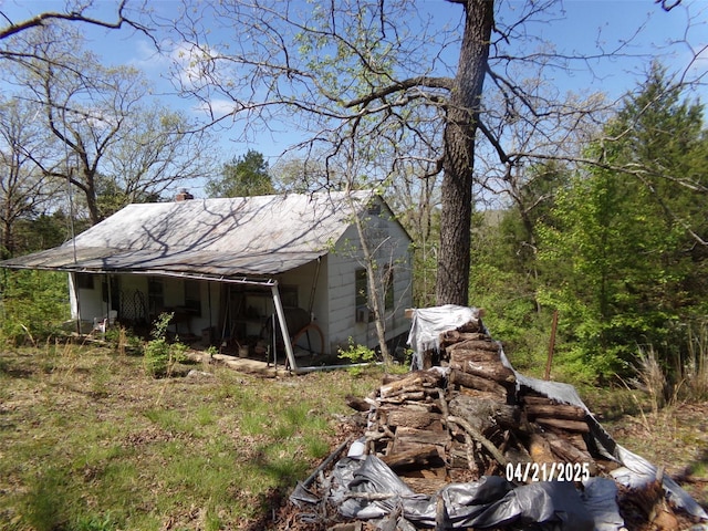 view of home's exterior featuring a shingled roof