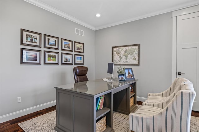 office area with wood finished floors, visible vents, crown molding, and baseboards