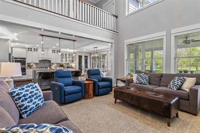 living room featuring carpet and recessed lighting