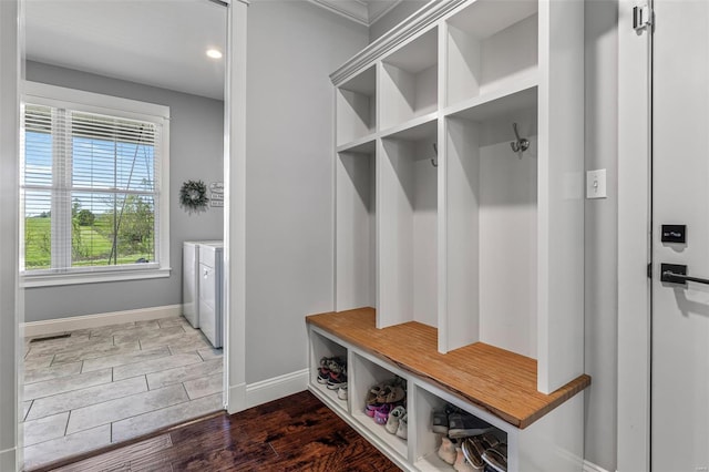mudroom featuring separate washer and dryer, baseboards, wood finished floors, and recessed lighting