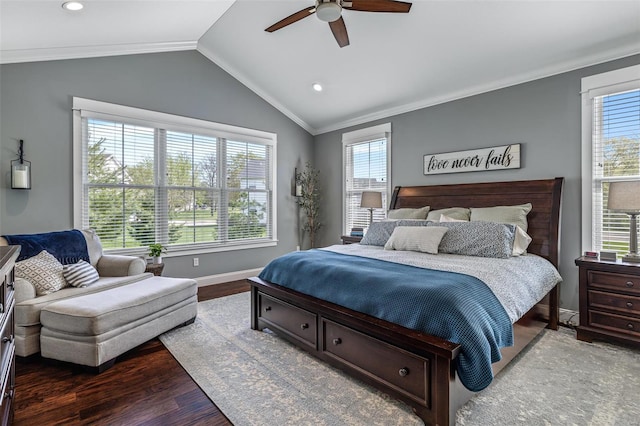 bedroom featuring baseboards, vaulted ceiling, wood finished floors, and multiple windows