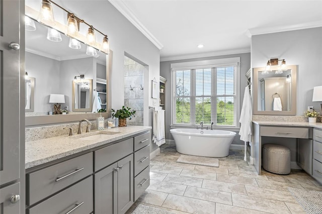 full bath featuring a soaking tub, vanity, recessed lighting, and crown molding