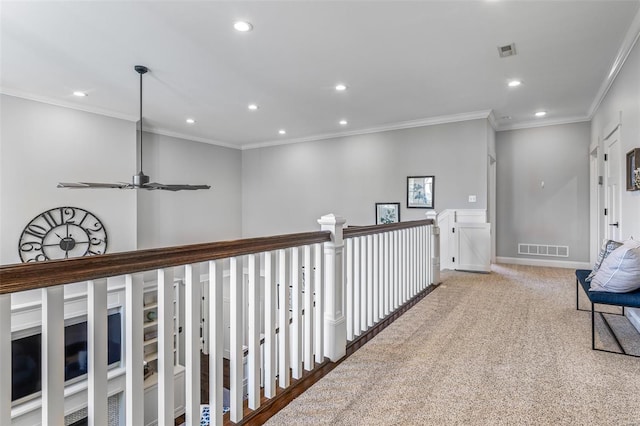 corridor featuring ornamental molding, visible vents, and recessed lighting