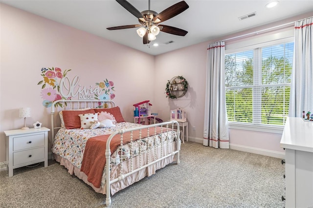 carpeted bedroom with recessed lighting, visible vents, baseboards, and multiple windows
