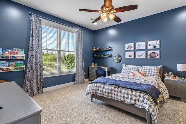 bedroom with visible vents, carpet flooring, baseboards, and a ceiling fan