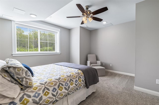 carpeted bedroom featuring ceiling fan and baseboards