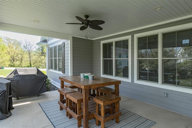 view of patio / terrace with a ceiling fan, outdoor dining area, and area for grilling
