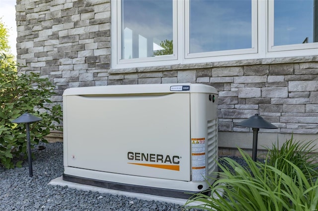 details with stone siding and a power unit